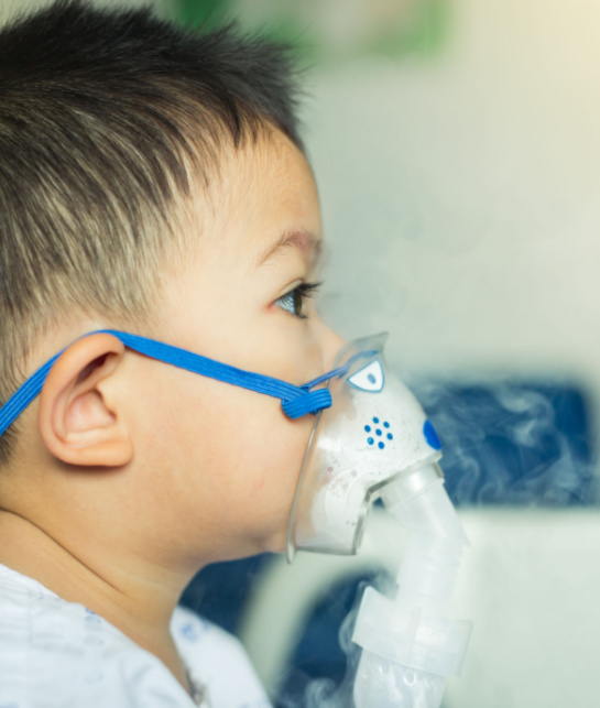 Boy with oxygen mask